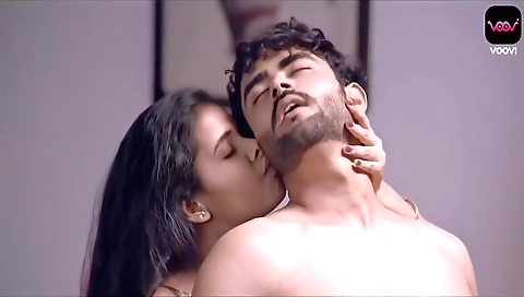 Latina girl in red shorts and sexy black shorts is on the bed