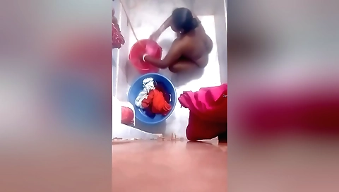 Hot brunette naked in the bathroom with a hidden cam