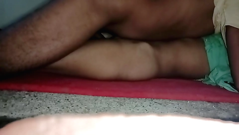 A teen in a white dress and a red dress is getting licked