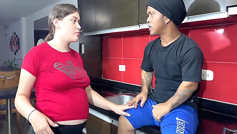 Busty stepsister gives him some food in the kitchen