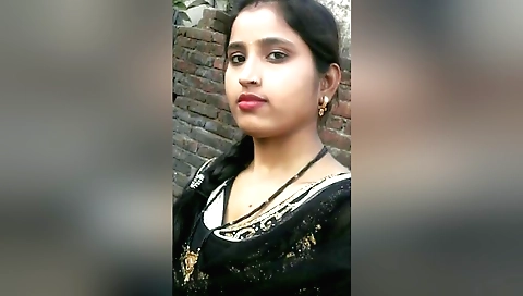 Busty brunette woman with a nice ass is stripping naked