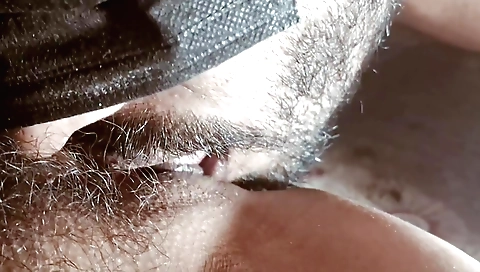 Indian hairy girl in black bikini shows her hairy bush