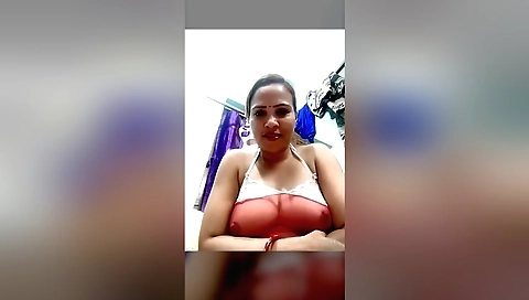 Bhabhi is playing with her big boobs on the webcam