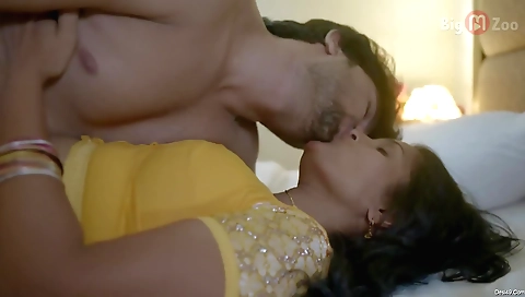 A brunette milf with a nice round ass is on her knees sucking a dildo