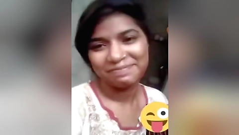 Solo female in a white sweater and stockings makes a video call