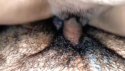 Hairy girl sucking black cock in the first-person sex clip