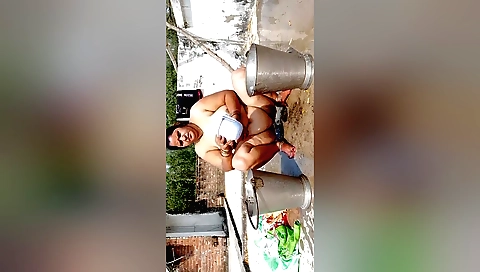 Busty Indian babe in a sexy outfit is in the bathtub