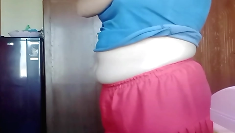 Indian chick plays with her pussy in the living room